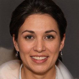 Joyful white adult female with short  brown hair and brown eyes