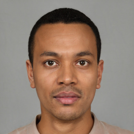 Neutral latino young-adult male with short  black hair and brown eyes
