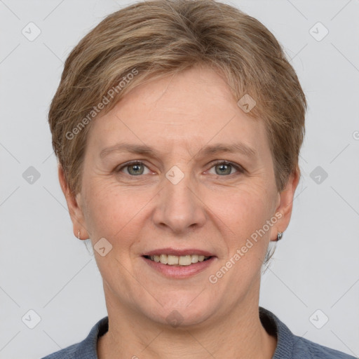 Joyful white adult female with short  brown hair and grey eyes