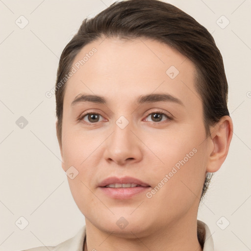 Joyful white young-adult female with short  brown hair and brown eyes