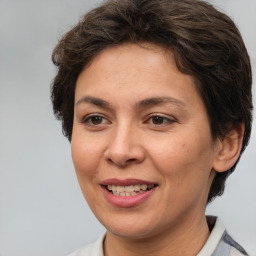 Joyful white adult female with short  brown hair and brown eyes