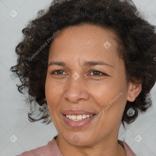 Joyful latino adult female with medium  brown hair and brown eyes