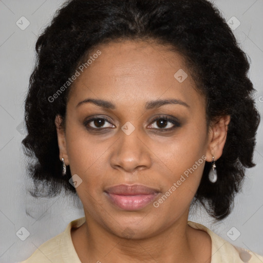 Joyful latino adult female with medium  brown hair and brown eyes