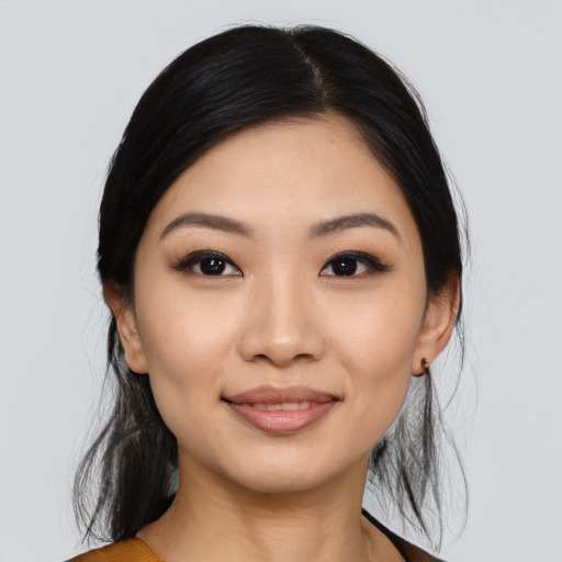 Joyful asian young-adult female with medium  black hair and brown eyes