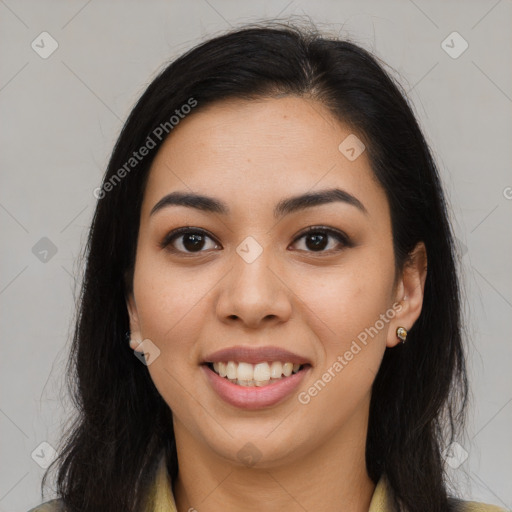 Joyful latino young-adult female with long  brown hair and brown eyes