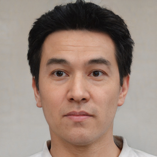 Neutral white adult male with short  black hair and brown eyes