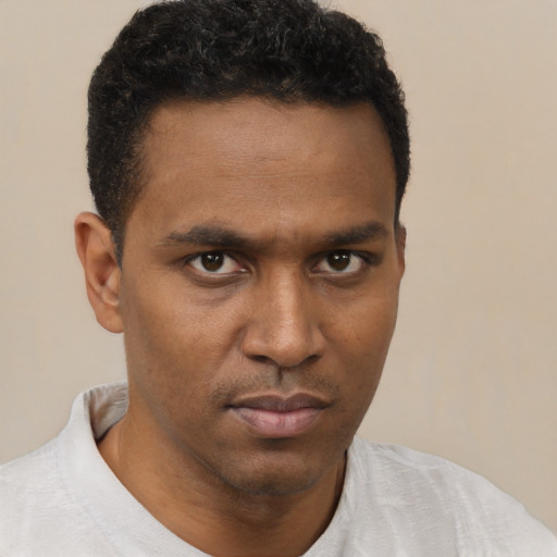 Neutral black young-adult male with short  black hair and brown eyes