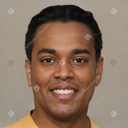 Joyful latino young-adult male with short  black hair and brown eyes