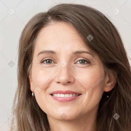 Joyful white young-adult female with long  brown hair and grey eyes