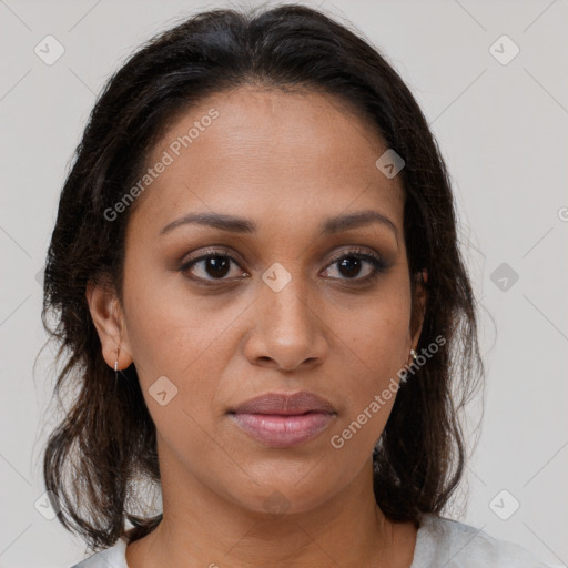 Joyful black young-adult female with medium  brown hair and brown eyes