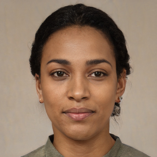 Neutral black young-adult female with short  black hair and brown eyes