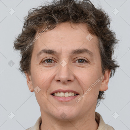 Joyful white adult female with short  brown hair and brown eyes