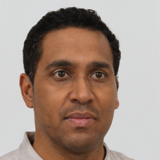Neutral black adult male with short  brown hair and brown eyes