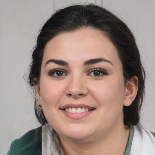 Joyful white young-adult female with medium  brown hair and brown eyes