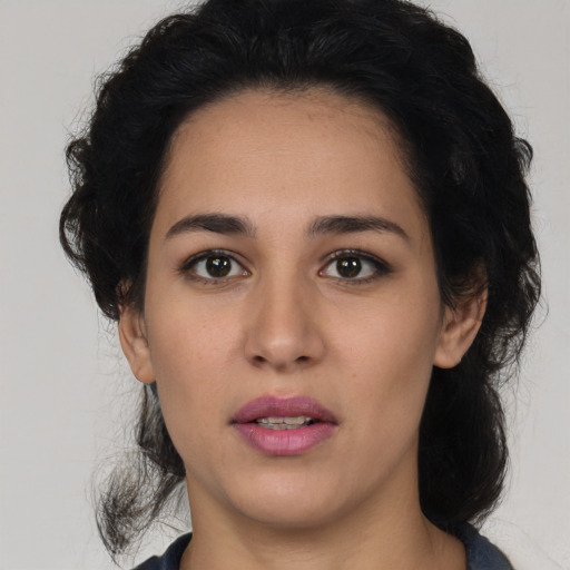 Joyful white young-adult female with medium  black hair and brown eyes