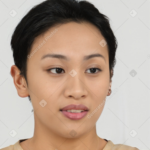 Joyful asian young-adult female with short  brown hair and brown eyes