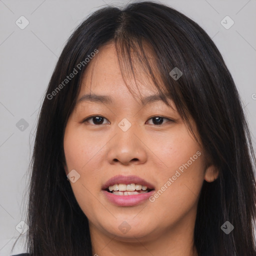 Joyful asian young-adult female with long  brown hair and brown eyes