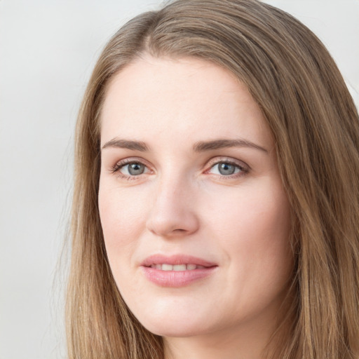 Joyful white young-adult female with long  brown hair and green eyes