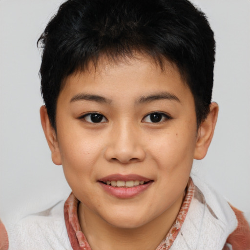 Joyful asian child female with short  brown hair and brown eyes