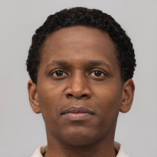 Neutral black young-adult male with short  brown hair and brown eyes