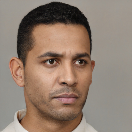 Neutral latino young-adult male with short  black hair and brown eyes