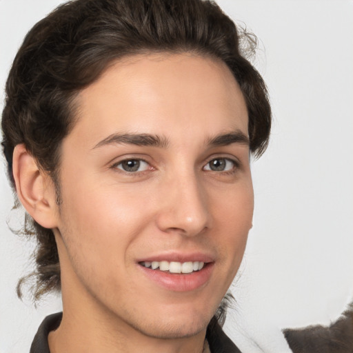 Joyful white young-adult male with medium  brown hair and brown eyes