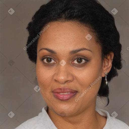 Joyful black adult female with short  brown hair and brown eyes