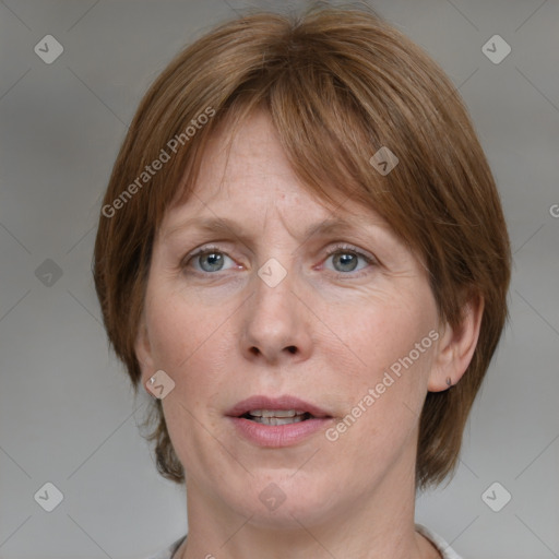 Joyful white adult female with medium  brown hair and grey eyes