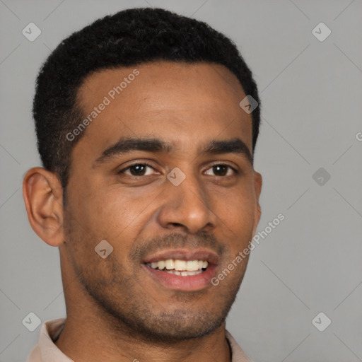 Joyful black young-adult male with short  brown hair and brown eyes
