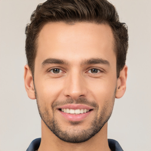 Joyful white young-adult male with short  brown hair and brown eyes