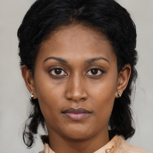 Neutral black young-adult female with medium  brown hair and brown eyes