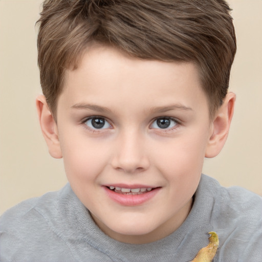 Joyful white child male with short  brown hair and brown eyes