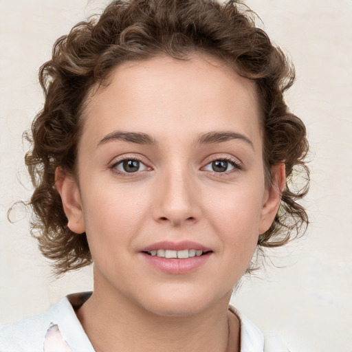 Joyful white young-adult female with medium  brown hair and green eyes