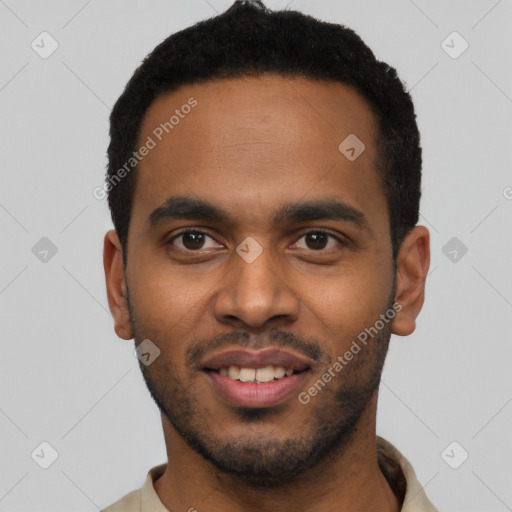Joyful black young-adult male with short  black hair and brown eyes