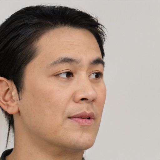 Neutral asian young-adult male with short  brown hair and brown eyes