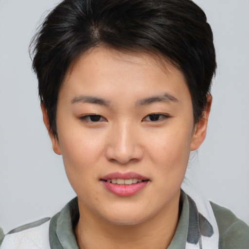 Joyful asian young-adult female with short  brown hair and brown eyes