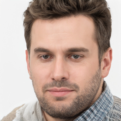 Joyful white young-adult male with short  brown hair and brown eyes