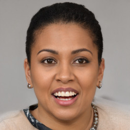 Joyful latino young-adult female with short  brown hair and brown eyes