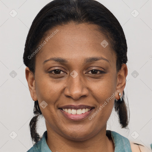 Joyful latino adult female with medium  brown hair and brown eyes