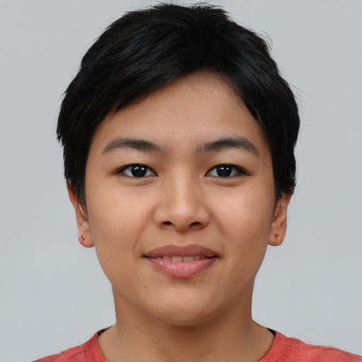 Joyful asian young-adult female with short  black hair and brown eyes