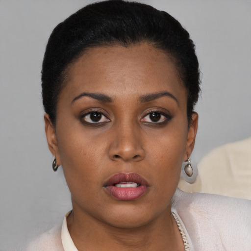 Neutral black young-adult female with short  black hair and brown eyes