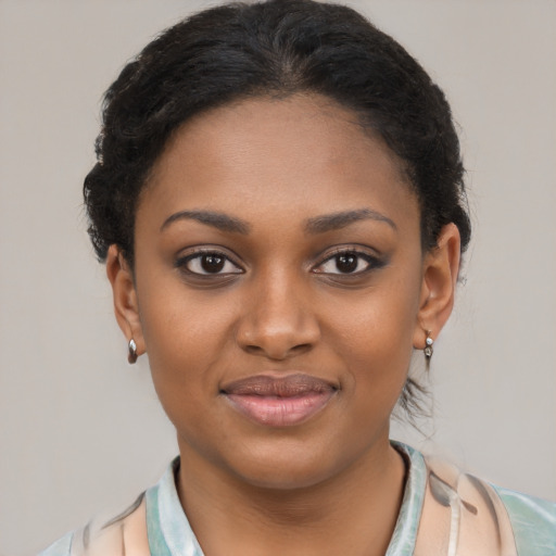 Joyful latino young-adult female with short  brown hair and brown eyes