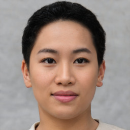 Joyful asian young-adult female with short  black hair and brown eyes