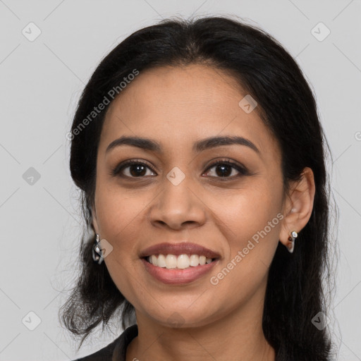 Joyful latino young-adult female with long  brown hair and brown eyes