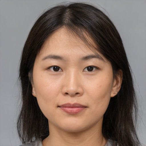 Neutral asian young-adult female with medium  brown hair and brown eyes