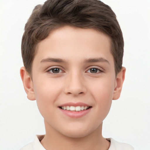 Joyful white child male with short  brown hair and brown eyes