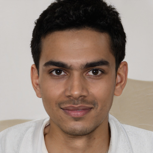 Joyful latino young-adult male with short  black hair and brown eyes