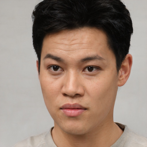 Neutral asian young-adult male with short  black hair and brown eyes