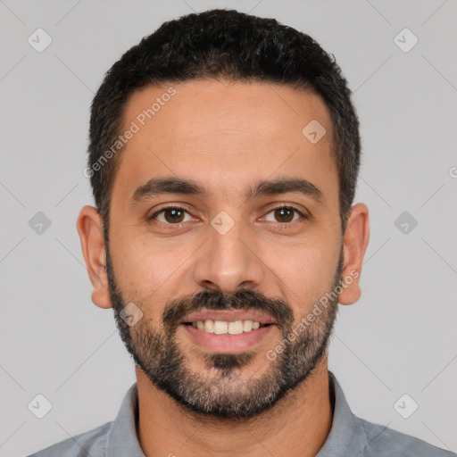 Joyful white young-adult male with short  black hair and brown eyes