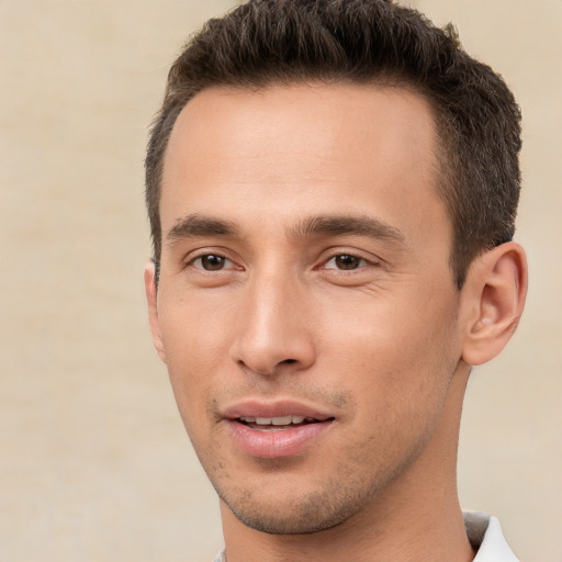 Joyful white young-adult male with short  brown hair and brown eyes